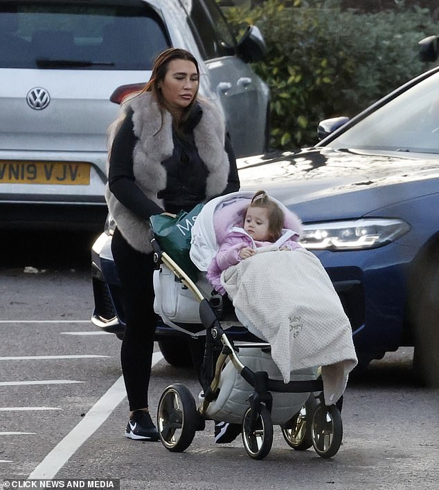 Outfit: The former TOWIE star, 36, dressed for the outing in a black jacket that she wore with a matching pair of leggings