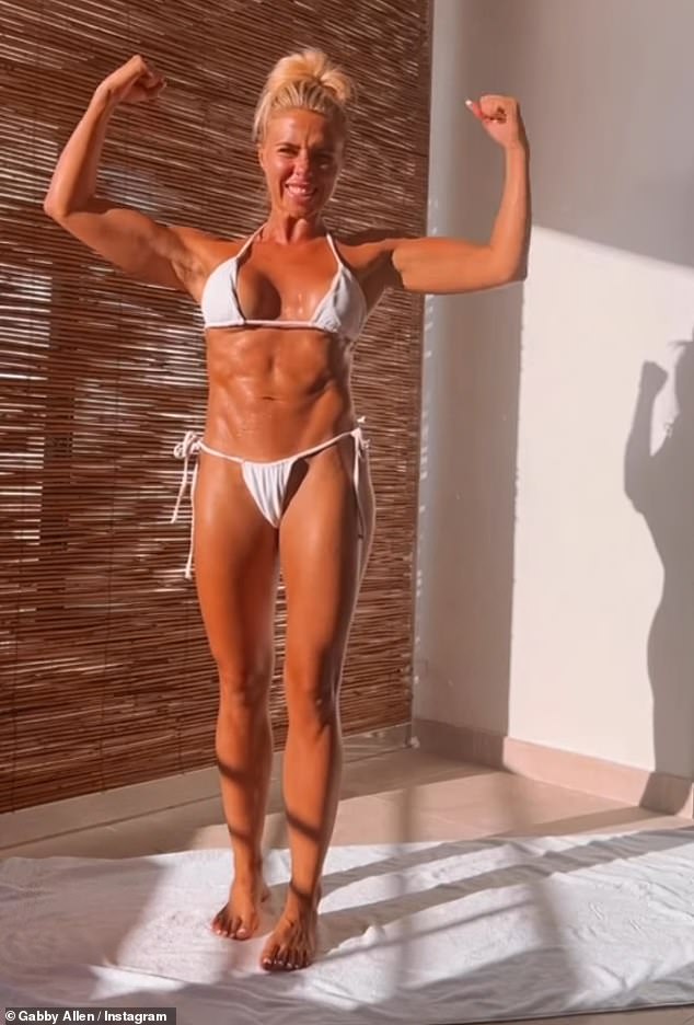 Stunning: Gabby Allen showed off her impossibly chiseled figure in a white bikini while flexing her muscles on Instagram on Wednesday