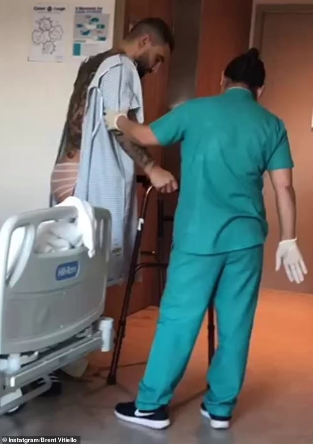 The reality star also shared a video showing him slowly making his way out of his hospital room with the help of a walker and a nurse.