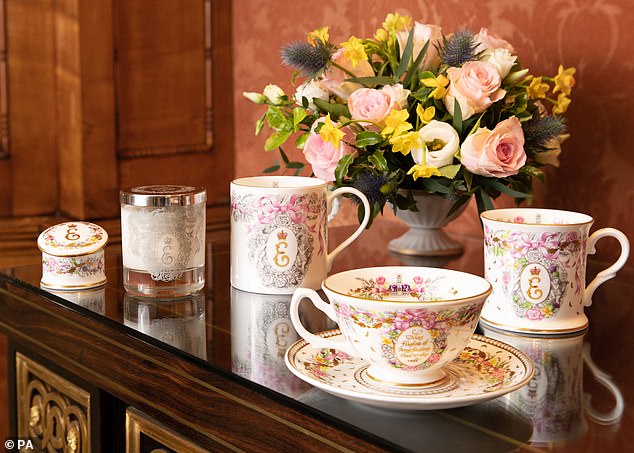 The Royal Collection Trust pieces include mugs, teacups and saucers, a pill box and tea towels, are on display at Buckingham Palace and range in price from £25 to £65