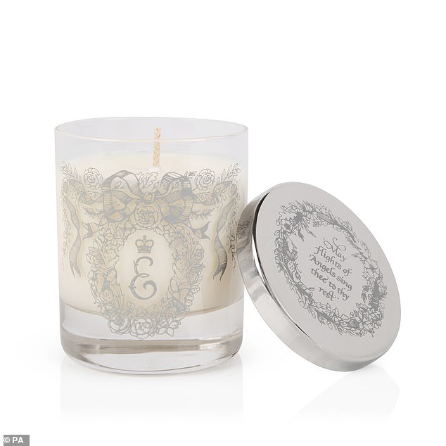 A votive candle is also on sale for £65 and flowers that rested on the Queen's coffin during her state funeral, including roses, myrtle, rosemary and oak leaves taken from the gardens of the royal residences, are featured in the decorative border.