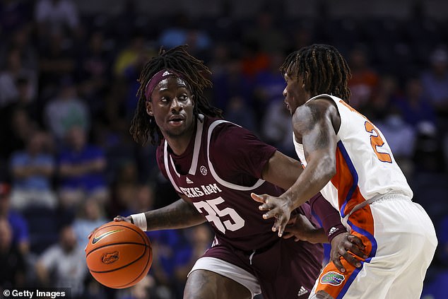 Texas A&M Aggies' Manny Obaseki dribbles the ball against Florida Gators' Trey Bonham during the first half of a game at the Stephen C. O'Connell Center on Wednesday.