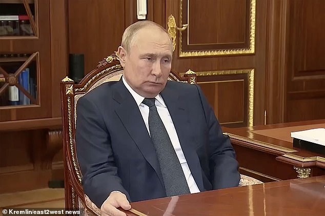 Asked when he thinks Putin's death will come, Budanov said he thought it would be very soon.  Pictured: Putin grips the desk in a meeting with the head of the National Guard, Viktor Zolotov, the Kremlin, Moscow, Russia, in August 2022.