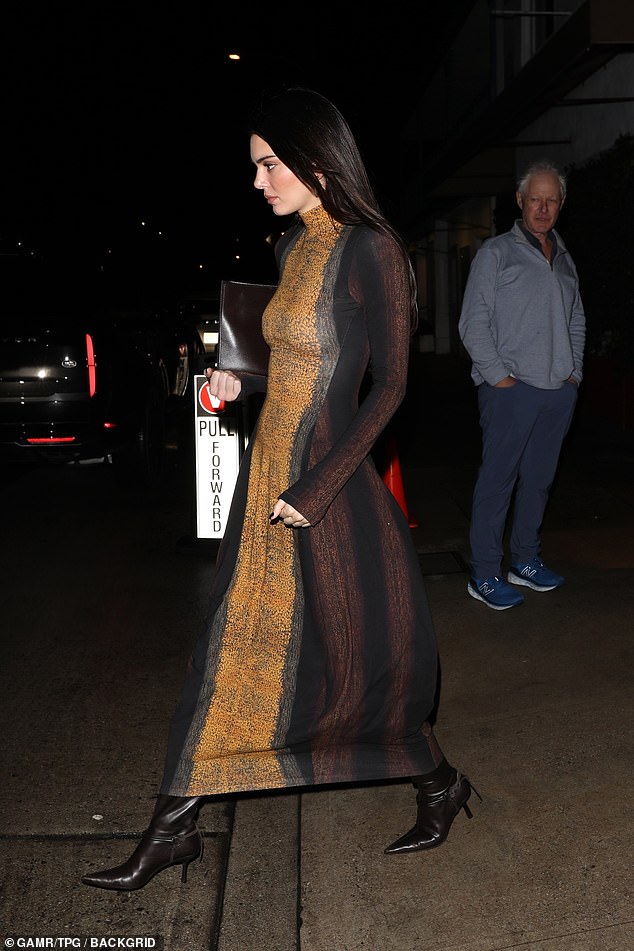 On the way: Kendall was photographed leaving the restaurant alone in high-heeled booties, clutch bag in hand.