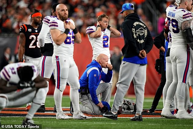 Buffalo Bills head coach Sean McDermott kneels as Buffalo Bills safety Damar Hamlin (3) is treated on the field following a first quarter collision against the Cincinnati Bengals at Paycor Stadium.