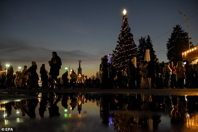 The Russian Orthodox Church, which uses the ancient Julian calendar, celebrates Christmas on Jan. 7 - later than the Gregorian calendar - although some Christians in Ukraine also mark the holiday on that date. Pictured: A Christmas tree is seen in Kyiv on January 2