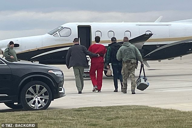 The criminal justice graduate student was wearing his red prison jumpsuit, and the lockdown for his arrival lasted until he reboarded the plane, which is owned by the state.