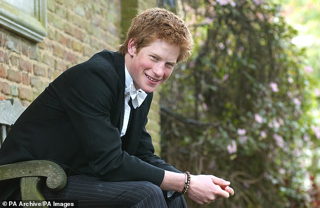 Prince Harry, pictured in his Eton College uniform in 2003, recalled learning about the 9/11 attacks while at school.  He watched the news among his classmates, who were stunned into silence at the horrible world event unfolding.