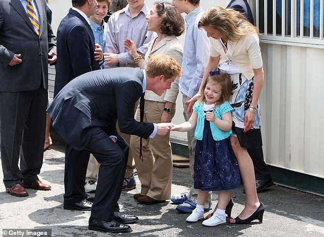 Prince Harry meets Monica Iken, who lost her husband in the World Trade Center attacks