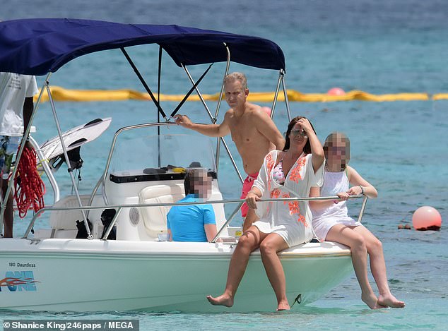 Family man: British TV presenter, 57, father of daughters Harriet, 32, Alice, 19, Ava, 17, Henry, 13, Oliver, two, and is married to Vicky Burton ( pictured with Vicky and one of her daughters in Barbados in 2018), she has had more quality time with family in recent years