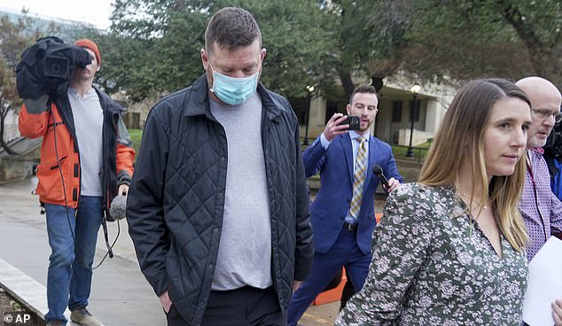 Texas men's basketball coach Chris Beard, second from left, leaves the Travis County Jail in Austin, Texas, Monday, December 12.