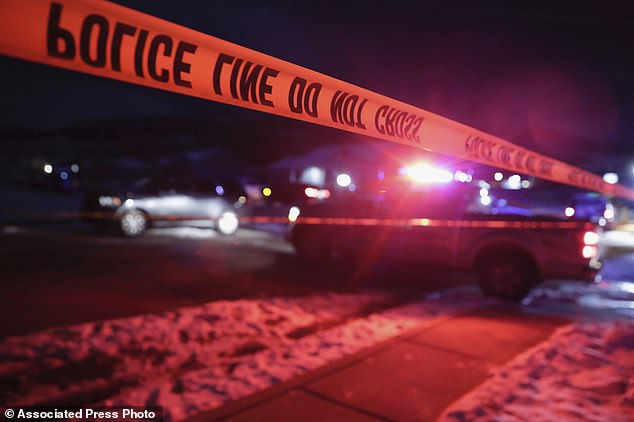 Police tape surrounds a crime scene in Enoch, Utah, where eight members of a family were found with gunshot wounds.