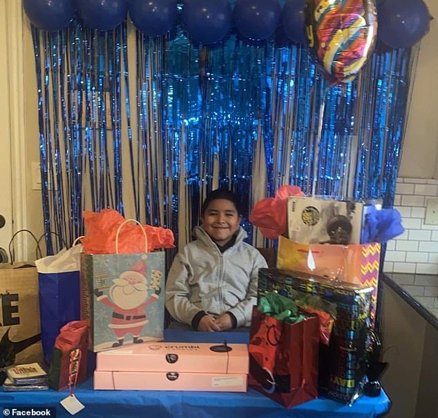 After the community came together, Jaydenn's mom took this photo of her son with gifts from his neighbors.