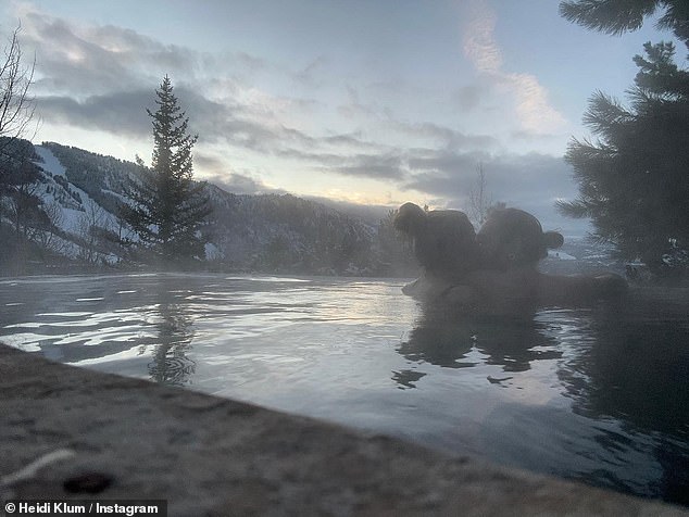 Intimate: The TV personality began her flurry of Instagram posts by sharing a photo of her and husband Tom Kaulitz sharing a passionate kiss in an outdoor hot tub