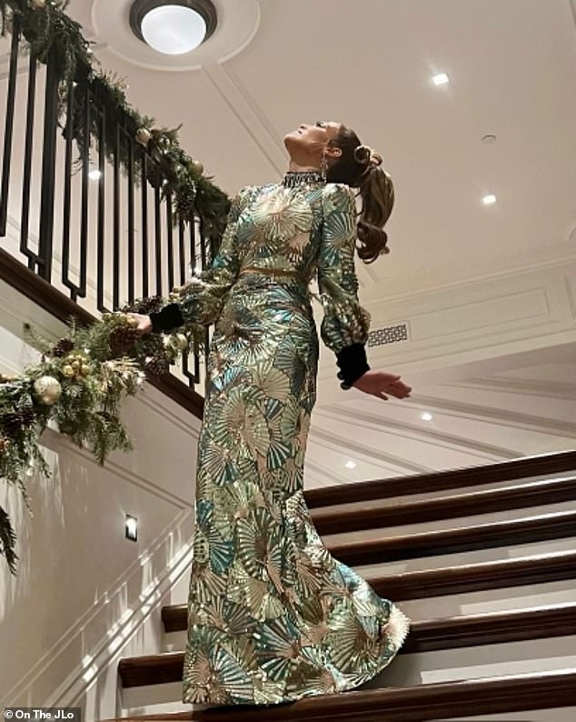 In the spirit: In an earlier shot, Jennifer highlighted the couple's garland-wrapped staircase that had clustered pine needles and twinkly lights throughout