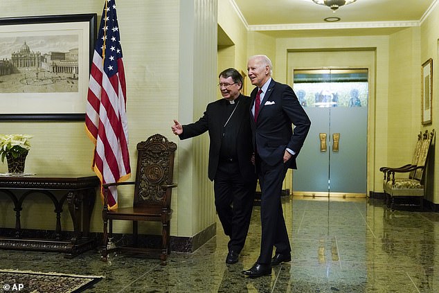 President Joe Biden (right) is greeted at the Vatican embassy, ​​technically the Holy See Apostolic Nunciature, by Archbishop Christophe Pierre (left) on Thursday evening.