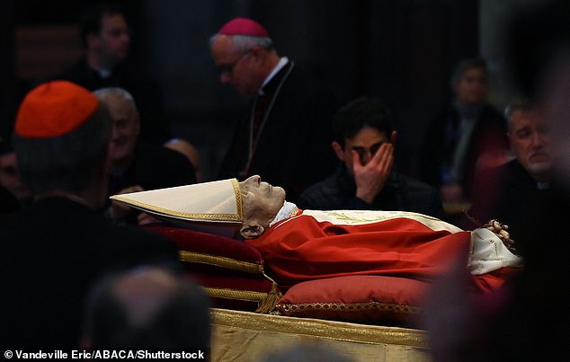 The body of Pope Emeritus Benedict XVI lies in state in St. Peter's Basilica in the Vatican on Wednesday.