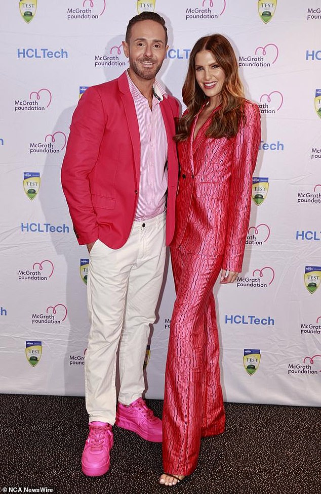 Cricket WAG Erin Holland, right, wore a pink suit with cracked material