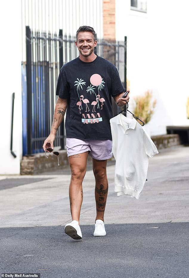 Thomas, 35, showed off his muscular body in a black Nana Judy graphic T-shirt that had a flamingo design, purple shorts and white shoes.