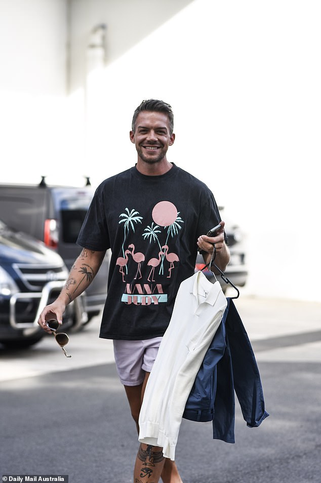 The Sydney-based restaurant manager completed his look with a pair of designer sunglasses and had his hands full with different shirts that he wore throughout the shoot.