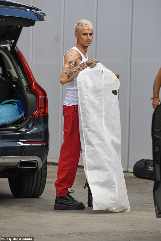 Melbourne rocker Jed, 25, showed off his tattoos in a white T-shirt