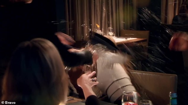 Oh no!  Never talk about my husband!  An enraged Lisa replied as she jumped off the table and lunged at Richards, then threw a drink at her face and smashed a wine glass on the table.