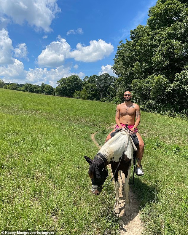 Shirtless: Accompanying the gorgeous caption were a number of photos, including one of Cole shirtless on horseback