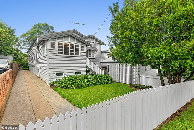 The family-size Queenslander (pictured) sits on a 607-square-metre block and features three bedrooms and two bathrooms.