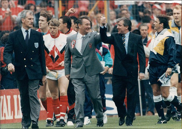 Tottenham boss Venables shakes hands with Nottingham Forest manager Brian Clough as they lead their teams in the 1991 FA Cup Final.