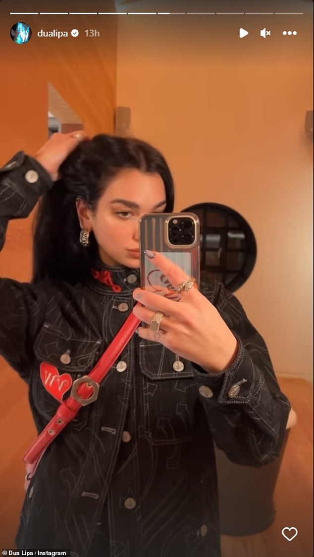 Wow: Dua accessorized with a pair of chunky silver earrings and some silver rings that went perfectly with her jacket and bag hardware.