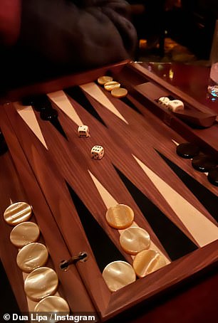 Game time: Dua and her friends also played a game of backgammon on Thursday night.