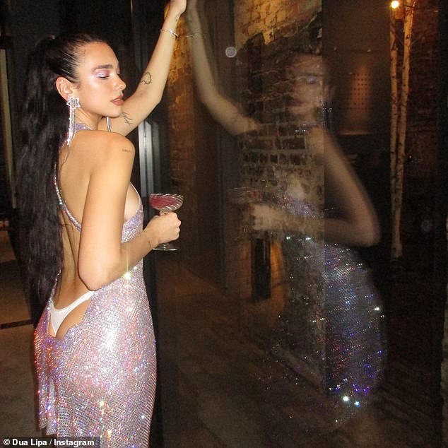 Sensational: Dua Lipa looked nothing short of sensational in a series of sizzling New Year's Eve snaps as she enjoyed a reunion with some of her nearest and dearest