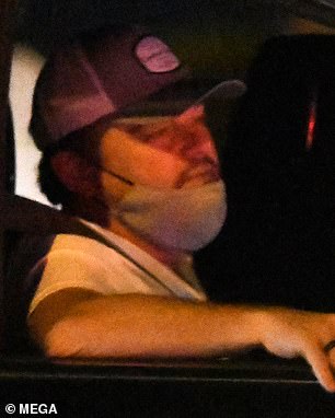 Snoozy: Leo was previously seen out and about in Miami wearing a plain white T-shirt and gray shorts, yawning as his chauffeur drove him around.