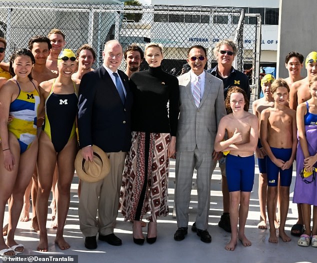 In the undated snaps, the former Olympic swimmer looked chic in a black polo neck and red patterned midi skirt.