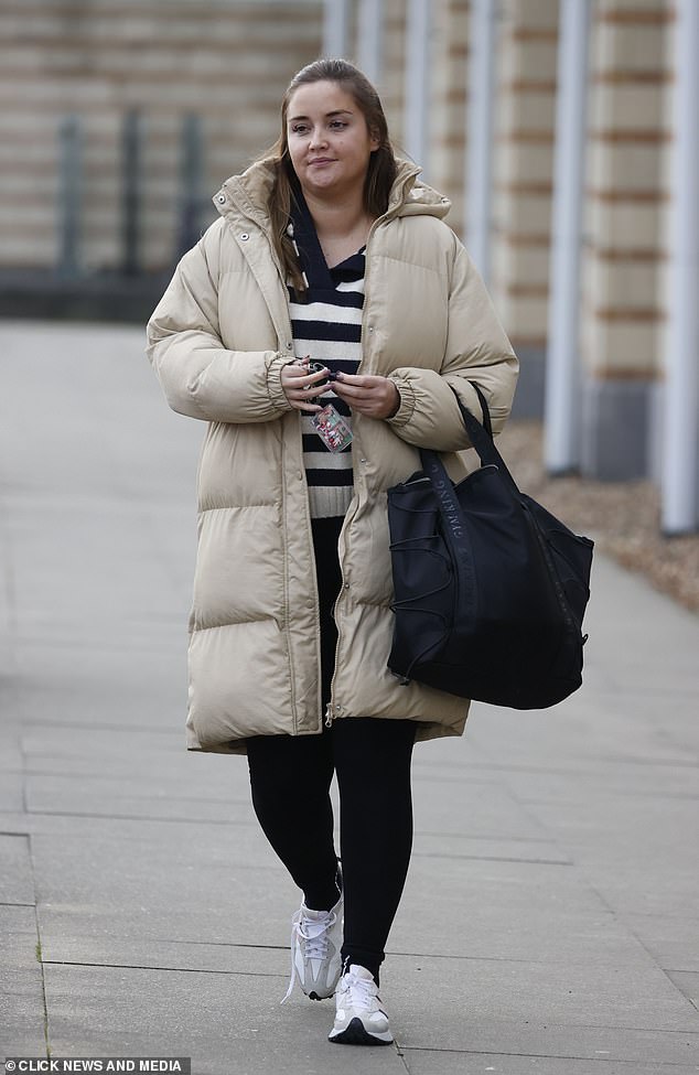 Looking good: The actress, 30, looked naturally gorgeous removing her make-up after sweating it out at the gym in Essex, wearing a beige puffer jacket and sports leggings