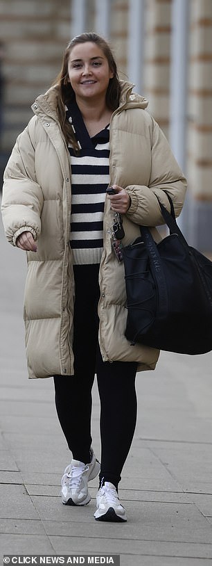 Cozy: She carried a black Gym King tote bag that held all her essentials while she enjoyed a Friday morning weight-lifting session.