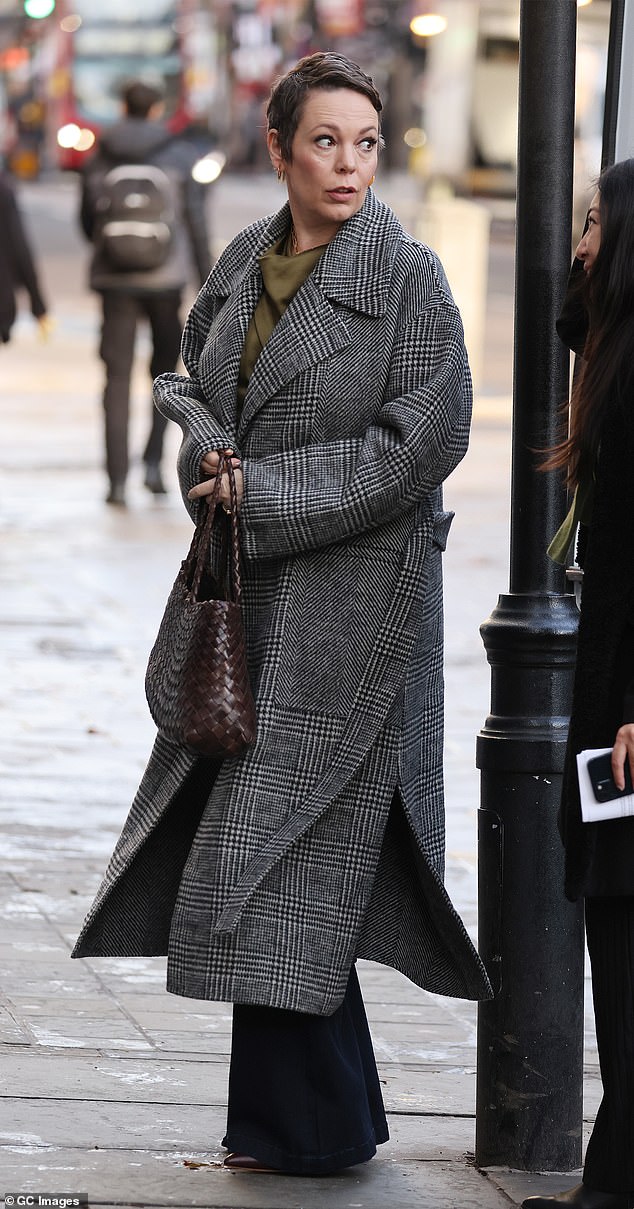 Stylish: The actress who stepped out to talk about her latest film Empire Of Light, opted for a checked wool coat with a pair of flared pants for her look