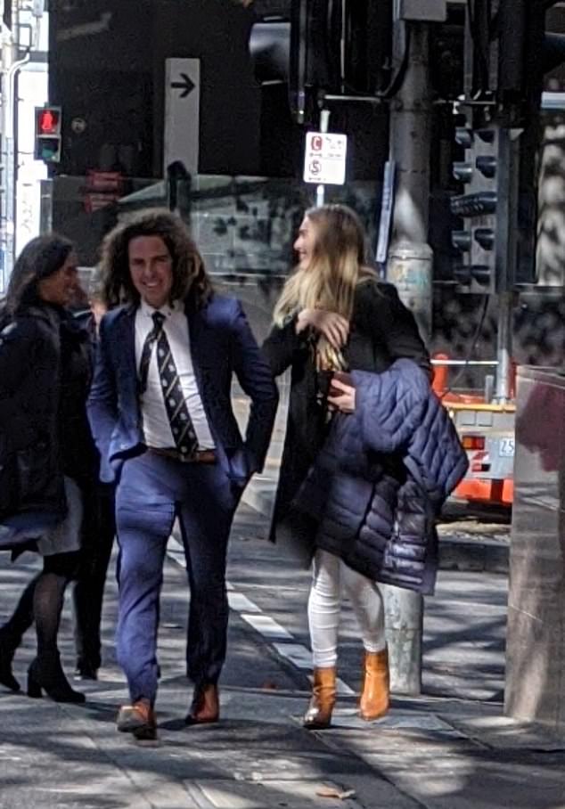 Alexandra McDonough laughs with Callum Buczak as they approach Melbourne Magistrates Court in May last year.