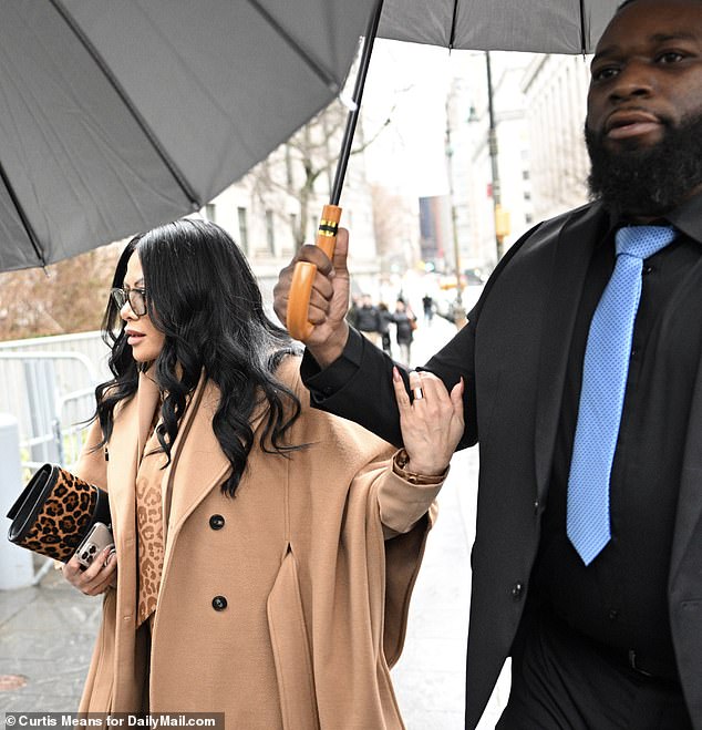 Jen Shah grabbed the arm of her bodyguard as she entered the courthouse on Friday morning.