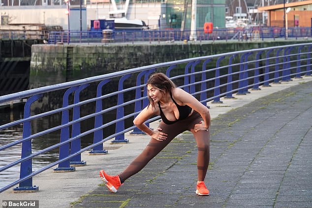 Outfit: The media personality also rocked a pair of skintight brown leggings along with red sneakers