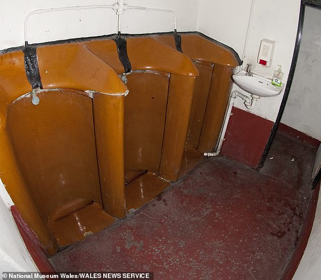 Old fashioned urinals shortly before they were dismantled from the old pub