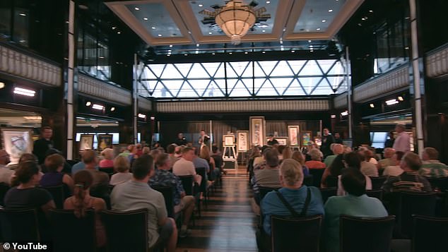 An art auction on board in one of the galleries that operate on the ships.