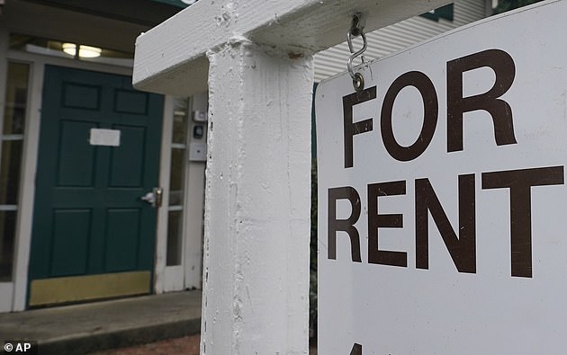 A rent sign is posted in Sacramento, California, high rents make roommates a necessity in the Golden State