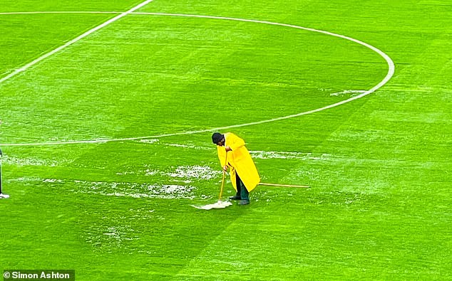 Heavy rain continued on Friday, but fielders worked with squeegees and pitchforks to try to clear away the water and make the surface playable.