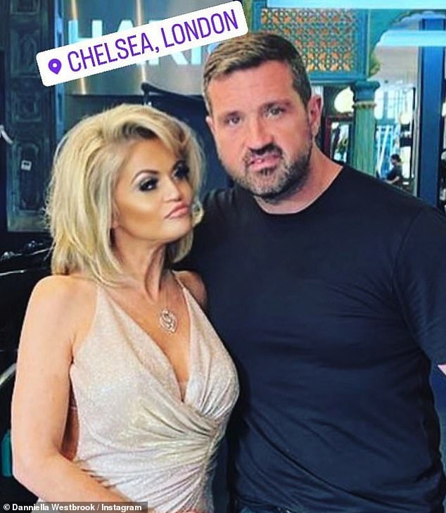 Posing: The actress posed up a storm in a low-cut gold dress with her blonde locks perfectly styled into loose waves after a blow-dry (pictured with stylist Daniel Jordan)