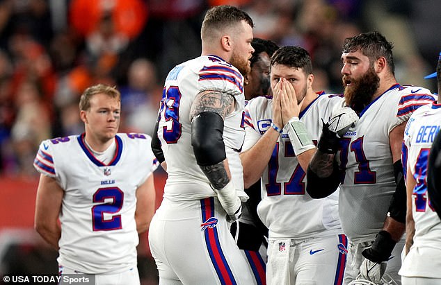 Allen (17) and the Buffalo Bills react as Hamlin is treated on the field after a collision