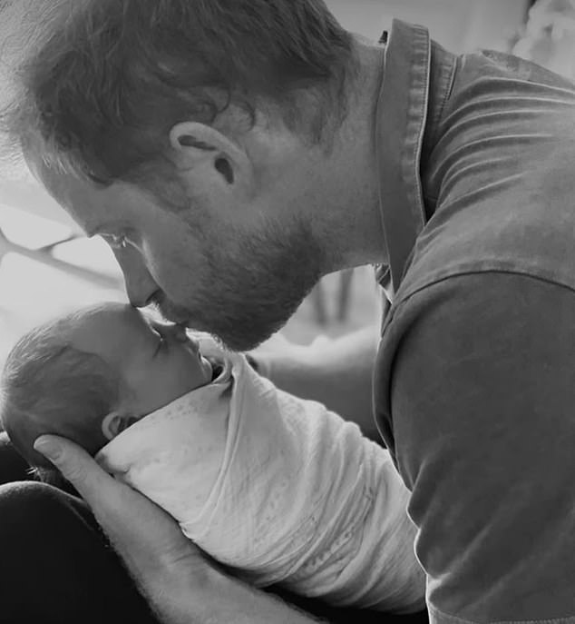 Prince Harry pictured with baby Lilibet Diana.  In his new biography, Spare, the duke describes how he helped deliver his daughter in June 2021.