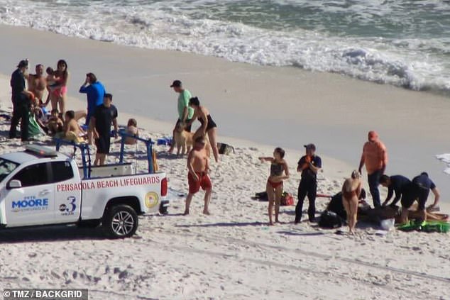 A chaotic scene is shown on a Pensacola beach, where Peyton Hillis was rescued after a swimming accident on Wednesday.