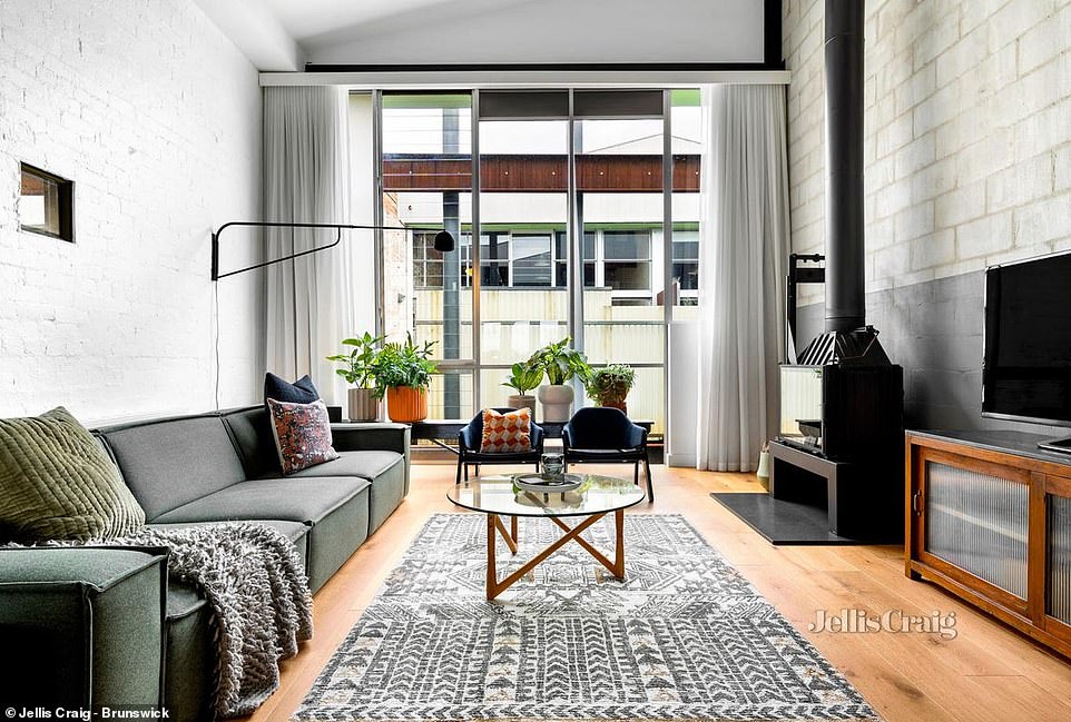 Apartment number four is a stylish three-bedroom sanctuary that blends original industrial details like exposed red brick and beamed ceilings with contemporary design elements.