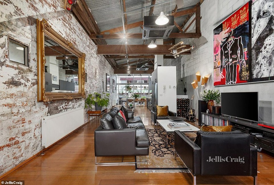 Apartment number two has aged red brick and original warehouse fixtures throughout, blending the old with the new and is the epitome of classic Melbourne style.